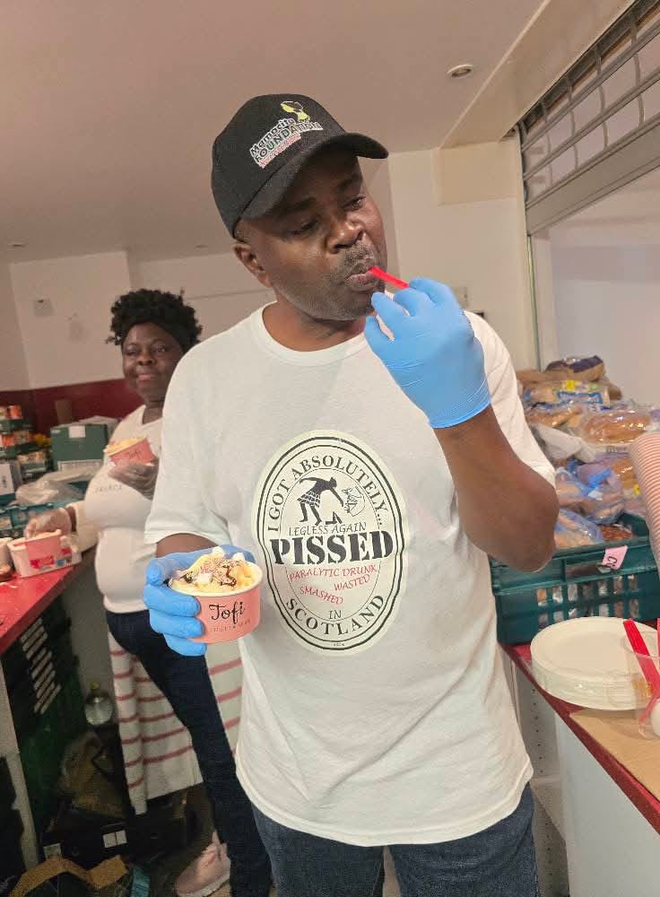 Man tasting ice cream at community event
