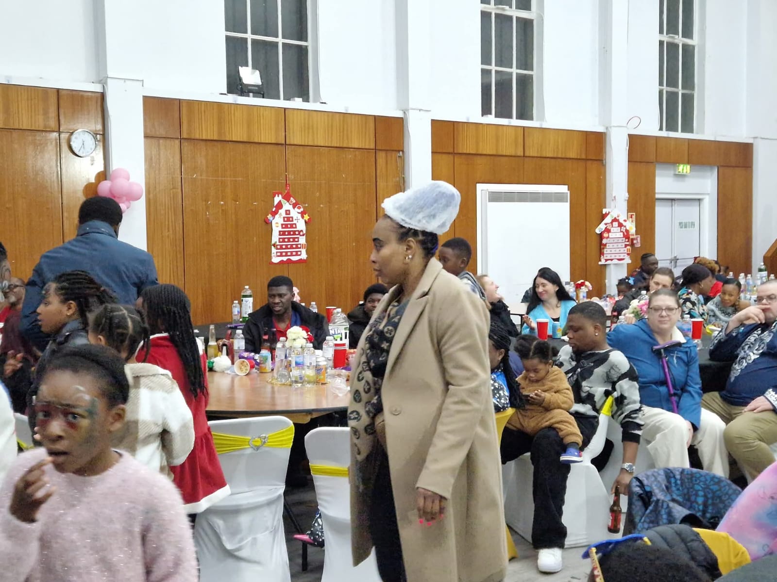 Woman at community event with children