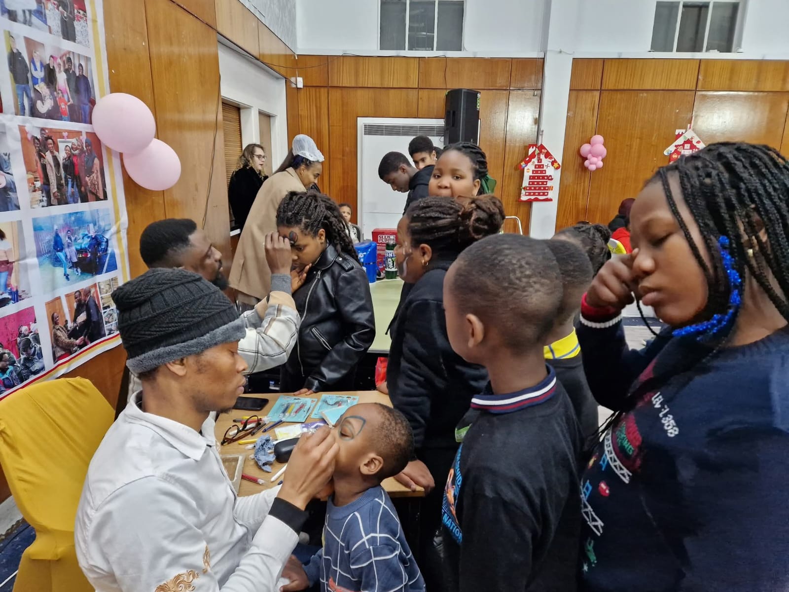 Children participating in face painting activity